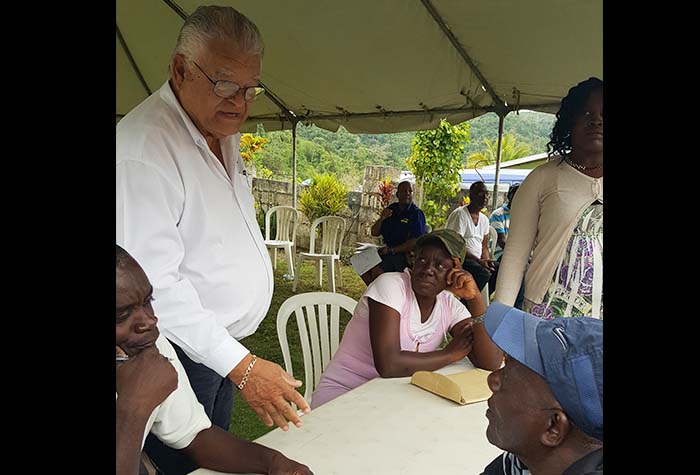 Minister of Industry, Commerce Agriculture and Fisheries, Hon Karl Samuda (2ND Left) , greets farmers at the launch of the 2016/17 Irish Potato Programme at the Shiloah Apostolic Church in Malton, Manchester on Friday (March 24). 