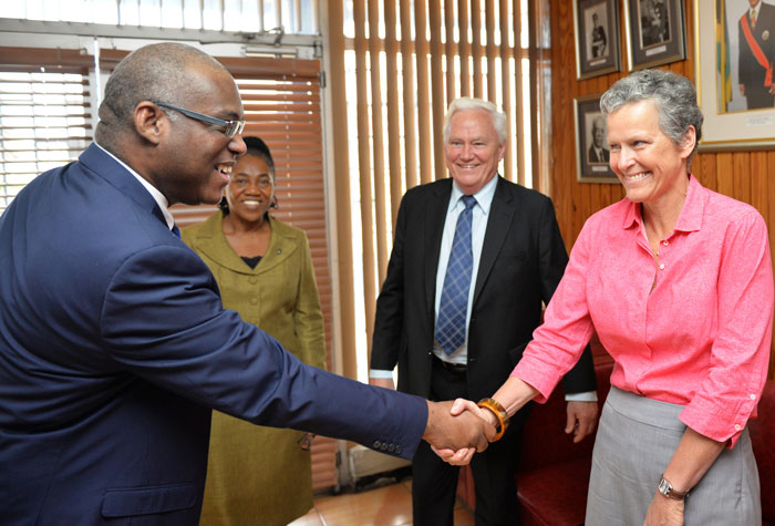 Deputy Chief Executive Officer of the Jamaica Information Service (JIS), Ian Boyne (left), greets State-owned Enterprise Adviser to the Asian Development Bank (ADB), Laure Darcy (right), who is also Co-Author of the ADB report: ‘Finding Balance 2014: Benchmarking the performance of State-Owned Enterprises in Island Countries’. Miss Darcy, along with Former Minister of State-Owned Enterprises in New Zealand, Hon. Richard Prebble; and Deputy Financial Secretary with responsibility for Public Enterprises in the Ministry of Finance and Planning, Ann-Marie Rhoden, visited the JIS head office in Kingston on July 21, to participate in a Think Tank. The ADB representatives are in Jamaica to present their report findings to  policy makers and senior executives of the Government of Jamaica.