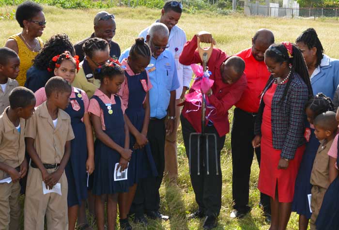 Mayor of Lucea and Chairman of the Hanover Parish Council, Wynter McIntosh (centre), officially breaks ground for the construction of the Esher Primary School’s pedestrian shelter, to be constructed by the Grand Palladium Resort and Spa’s Staff Association, at a cost of approximately $500,000, on December 8. Looking on are teachers, students and members of the hotel and community.