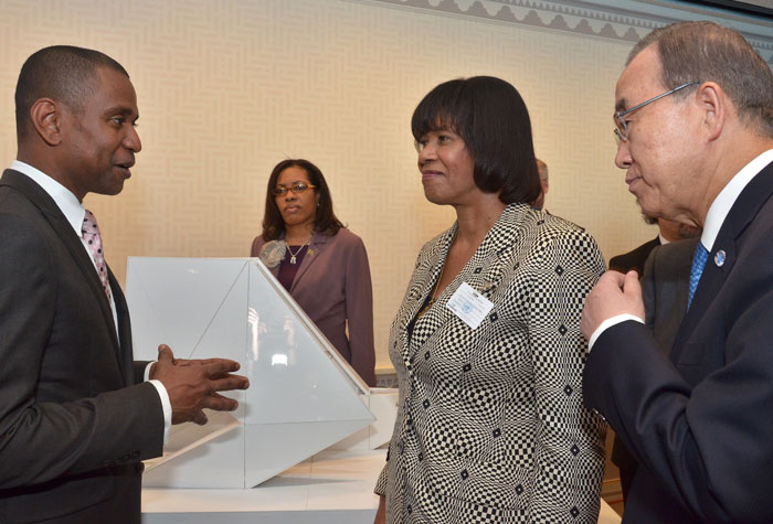 Prime Minister, the Most Hon. Portia Simpson Miller (second right), and Secretary General of the United Nations (UN), His Excellency Mr. Ban Ki-Moon (right), listen as Mr. Rodney Leon (right), explains the concept behind his winning design, ‘The Ark of Return’, to be erected as a Permanent Memorial to the victims of slavery and the transatlantic slave trade at the United Nations (UN) Headquarters in New York, at the unveiling at the UN on September 23. Also listening at second left is Miss Andrea Wilson of the Ministry of Foreign Affairs and Foreign Trade.
 
