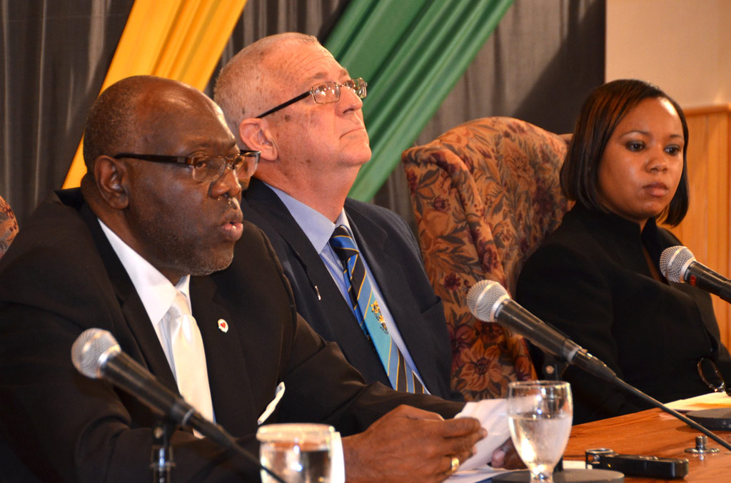 Health Minister, Hon. Dr. Fenton Ferguson (left), says the ban on smoking in specific areas is intended to reduce the unwanted effects of tobacco exposure on members of the public. The Minister was addressing journalists during a press briefing at the Office of Prime Minister on Monday (July 15). Also pictured are: Education Minister, Rev. the Hon. Ronald Thwaites (second left), and Legal Officer, Ministry of Health, Sheryl Dennis.