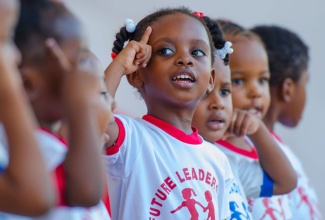 Mickayla Rhule of Future Leaders Care and Learning Centre (centre), performs with her peers for those in attendance at the Early Childhood Commission’s back-to-school fair, held at Emancipation Park in New Kingston, on August 21. (FILE)