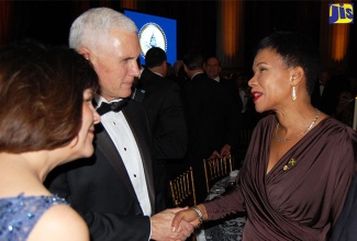 Ambassador to the United States, Her Excellency Audrey Marks (right), is greeted by United States Vice-President Elect, Governor Mike Pence, and his wife, Karen,  as she arrives at the Chairman’s Global Dinner and Diplomatic Ball given in honour of President Elect, Donald Trump and the Vice President, at the Andrew W. Mellon Auditorium in Washington DC, on January 16. The Vice President-Elect expressed his love for the people of Jamaica and hopes to visit one day.  The Ambassador will represent the Government and people of Jamaica at the inauguration ceremony of the President and Vice President  of the United States on January 20.
 
