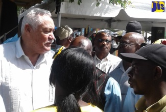 Minister of Transport and Mining, Hon. Lester ‘Mike’ Henry interacts with operators of public passenger vehicles (PPV) following the announcement that the Montego Bay Transport centre on Barnett Street in St. James will be renovated. The announcement was made at a media briefing held on Friday, February 23, at the Transport Centre.