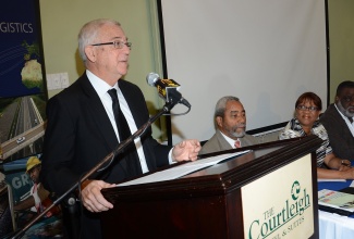 Minister of Education, Rev. Hon. Ronald Thwaites, addresses a logistics forum at the Courtleigh Hotel in New Kingston today (Jan. 31). Listening (from second left) are: Senior Advisor to the Minister, Dr. Franklin Johnston; Chairman, Caribbean Maritime Institute (CMI), Joan Spencer-Ernandez; and Chairman of the Logistics and Investment Task Force in the Ministry of Industry, Investment and Commerce, Dr. Eric Deans. The forum was organised by the Logistics Task Force Sub-committee on Education and Training to provide an update on the progress made on the training and education aspect of the Logistics Hub initiative.