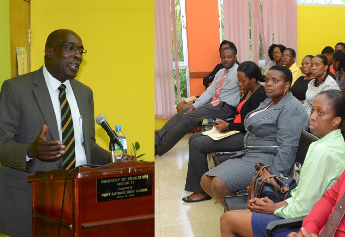 Education, Youth and Information Minister, Senator the Hon. Ruel Reid (left), addressing staff at the Ministry’s Region Two office in Port Antonio, Portland, on June 16.