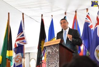 Prime Minister, the Most Hon. Andrew Holness makes a point while addressing attendees at a ceremony to induct him into the Park of Honour at the University of the West Indies, Mona, on May 3. Mr. Holness is the 18th Head of Government to be inducted into the park, which was established in 2005 to honour UWI graduates who have been or are serving as CARICOM Heads of Government.  