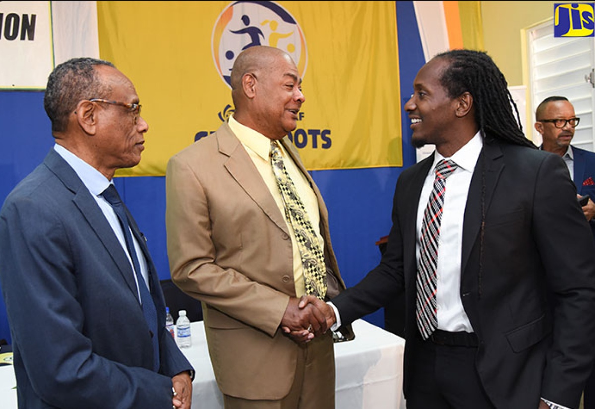 State Minister for Culture, Gender, Entertainment and Sport, Hon. Alando Terrelonge (right) speaking with CONCACAF Instructor, Vin Blaine, during the opening ceremony for the Confederation of North, Central America and Caribbean Association Football (CONCACAF) ‘D License’ coaching course in Jamaica on April 11 at the University of the West Indies (UWI)/Jamaica Football Federation (JFF) Captain Horace Burrell Centre of Excellence on the Mona Campus, St. Andrew. 