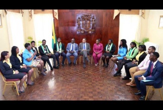 The Most Hon. Andrew Holness, Prime Minister with Audrey Sewell, Permanent Secretary and Ruel Reid, Minister of Education, Youth & Information addressed members of the Career Advancement Programme Entrepreneurship Team who copped second place at the Youth Entrepreneurship Summit at Delaware University in the United States recently. 