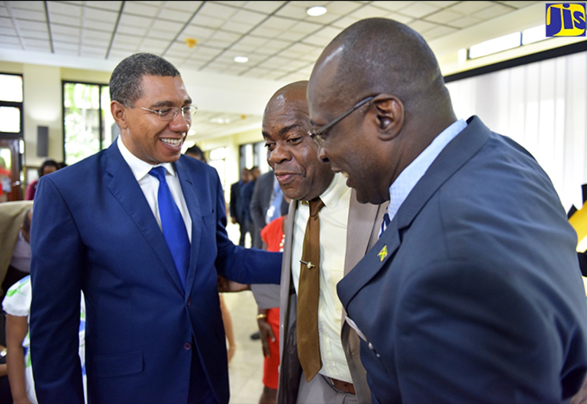 Prime Minister, the Most Hon. Andrew Holness (left), and Education, Youth and Information Minister, Senator the Hon. Ruel Reid (right), share a light moment with Opposition Senator, Dr. Floyd Morris, during Tuesday's (May 1) launch of activities for Workers' Week and Labour Day 2018. The launch took place at the Office of the Prime Minister. 