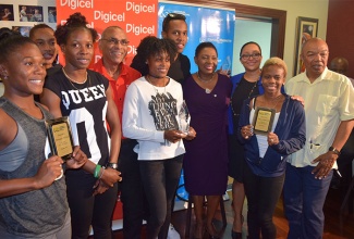 Minister of Culture, Gender, Entertainment and Sport, the Honourable Olivia Grange shares a moment with members of Jamaica’s team to the Rio Olympic Games at a welcome reception held last evening at the Norman Manley International Airport. (From left) Christania Williams, Stephenie Ann McPherson, Shericka Jackson, Elaine Thompson, Julian Forte and Megan Simmonds. The moment was also shared with Patrick King, Director, Customer Solutions at Digicel, Gabrielle Banbury-Kelly, Acting Chief Digital and Marketing Officer at the National Commercial Bank and Dr. Warren Blake, President of the Jamaica Administrative Athletic Association (JAAA).