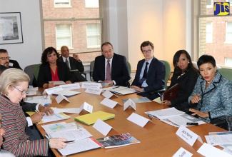 Jamaica’s Ambassador to the United States, Her Excellency Audrey Marks (rights) addresses executives of over thirty top Pennsylvania based platinum Enterprises, at a forum on investment opportunities in Jamaica hosted by the US Department of Commerce and the Greater Philadelphia World Trade Centre in conjunction with the Jamaican Embassy. It was held at  One Penn Centre, downtown Philadelphia on  February 27. 