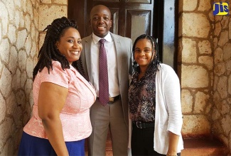 Minister of State in the Ministry of National Security, Senator the Hon. Pearnel Charles Jr., with Guidance Counsellors at Hampton School in St. Elizabeth (from left)  Kayon Whyne and Shellion Rowe, when he addressed the school’s  Safety and Security Staff Sensitisation Workshop on February 1.