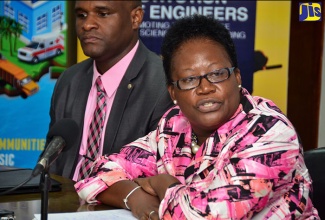 Principal, Maxfield Park Primary School, Beverley Gallimore-Vernon (right), shares the successes of her students from participating in the Jamaica Social Investment Fund (JSIF) science quiz last year. She was speaking at the recent launch of the competition at JSIF’s Oxford Road offices in Kingston. Also pictured is President, Jamaica Institution of Engineers (JIE), Dwight Ricketts.

