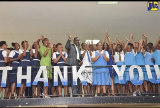 Minister of Education, Youth and Information, Senator the Hon. Ruel Reid (centre), joins students in thanking the National Commercial Bank (NCB) Foundation for providing $13 million in bursaries under its scholarship programme this academic year. The Foundation electronically transferred the funds to several high schools across the island during its Caribbean Secondary Education Certificate (CSEC) Principles of Accounts (POA) and Principles of Business (POB) National Bursary Awards function, held at Ardenne High School in St. Andrew on February 1.
 
