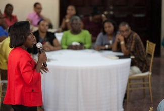 Psychologist with the Citizen Security and Justice Programme (CSJP) III, Stacey-Anne Whittingham-Tucker, delivers a presentation to a group of teachers and administrators from the Catherine Hall Primary and Infant School, during a capacity-building workshop at the Sea Garden Hotel in Montego Bay. The workshop is one in a series of school interventions aimed at helping teachers better address the concerns of children with behavioural challenges.