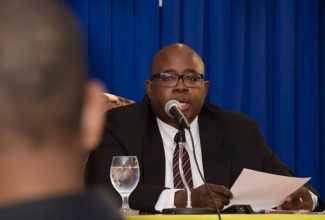 Executive Director of the Jamaica Anti-Doping Commission, (JADCO), Carey Brown makes a point at a press briefing held at the press room at the Office of the Prime Minister on Thursday, September 4.