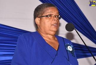 Permanent Secretary in the Ministry of Justice, Carol Palmer, address a recent restorative justice conference at the Spanish Court Hotel, St. Andrew. 

