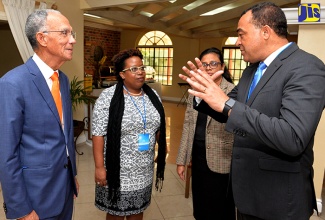 Minister of Health, Dr. the Hon. Christopher Tufton (right), speaks with (from left): President, Healthy Caribbean Coalition, Sir Trevor Hassell; Director, Non-Communicable Diseases and Injury Prevention, Ministry of Health, Dr. Tamu Davidson; and Acting Chief Medical Officer, Dr. Jacqueline McKenzie, at the Healthy Caribbean Coalition’s Caribbean Non-communicable Disease Forum held at The Knutsford Court Hotel in New Kingston on Monday (April 23).   

