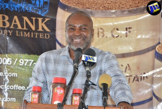 Chief Technical Director in the Ministry of Industry, Commerce, Agriculture and Fisheries, Dermon Spence, delivers the keynote address on behalf of portfolio Minister, Hon. Karl Samuda, at the launch of the Mavis Bank Coffee Factory Preferred Farmers’ Programme in rural St. Andrew on Thursday (September 8).