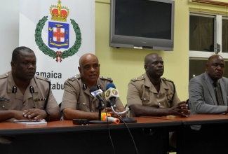 Commissioner of Police, George Quallo (second left), addresses  press briefing on Thursday (November 30) at the Freeport Police Station in Montego Bay, following a tour of communities in the area.  Others (from left) are Commanding Officer of Area One, Assistant Commissioner of Police, Donovan Graham;  Divisional Commander for the St. James Police Division, Senior Superintendent Wilfred Campbell; and Crime Chief for Area One, Superintendent Michael Phipps.