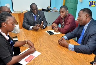 Minister of Education, Youth and Information, Senator the Hon. Ruel Reid (centre), in a meeting with stakeholders from Cumberland High School and Ministry personnel at the institution on November 14. Others are (from left): Dean of Discipline, René Level; Member of Parliament for St. Catherine South Eastern, Colin Fagan; Board Chairman, Rupert Pryce and Principal of the school, Michael Brydson.