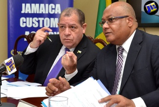 Finance and Public Service Minister, Hon. Audley Shaw (left), speaks with Jamaica Customs Agency (JCA) Chief Executive Officer and Commissioner of Customs, Major (Ret’d) Richard Reese, during a meeting at the entity’s head office in Newport East, Kingston, on Tuesday, August 9.