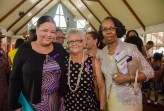 Minister with responsibility for Information and Gender Affairs, Senator the Hon. Sandrea Falconer (left), shares a moment with her mother, Gertrude Falconer (centre); and Permanent Secretary, Office of the Prime Minister (OPM), Elaine Foster Allen, following Sunday’s (November 22) commemorative church service to launch the observance of International Day for the Elimination of Violence Against Women. Senator Falconer delivered a message on behalf of Prime Minister, the Most Hon. Portia Simpson Miller, whom she represented. International Day for the Elimination of Violence Against Women will be observed on Wednesday, November 25, under the theme: ‘Violence does not Discriminate: Unite to End Gender-Based Violence’.