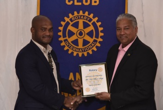 Director General of the Jamaica Civil Aviation Authority,  Nari Williams-Singh (right) is presented with a token of appreciation by President of the Rotary Club of St. Andrew North,  Andrew Jackson,  following an address to the club on the ongoing upgrades of the country’s Air Navigation systems.