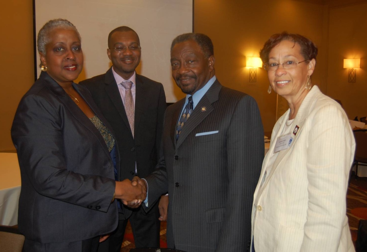 Director of Diaspora And Consular Affairs in the Ministry of Foreign Affairs and Foreign Trade, Ambassador Sharon Saunders (left), is greeted by Assistant Speaker Pro Tempore of the New York State Assembly, Jamaican-born Nick Perry (right). The occasion was the opening of the two-day Jamaica Diaspora North East Regional Conference at the Hilton New York JFK Hotel in Queens on June 10. Others sharing the moment (from 2nd left) are: Assistant Director Of Diaspora Affairs in the Ministry, Lincoln Downer; and Immediate Past President of the Union of Jamaican Alumni Associations, Karlene Largie.