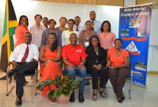 Principal of Sam Sharpe Teachers' College, in Granville, St. James, Dr.
Asburn Pinnock (seated, left) and Chairman of the Jamaica Diaspora Education Task Force, Mr. Leo Gilling (seated, centre), with other participants at the Diaspora 'Day of Service',  held at the college on June 18. The event included interactive workshops and lectures, held under the theme:
'Strengthening capacity for improved learning outcomes'.      
