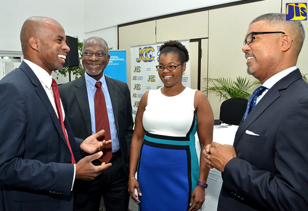 Jamaica Chamber of Commerce (JCC) First Vice President, Michael McMorris (2nd right), responds to a question on the JCC’s Business and Consumer Confidence Indices for the third quarter of 2016, which was released on October 11 at Spanish Court Hotel in New Kingston. Others (from left) are JCC Third Vice President and Chairman of the Jamaica Conference Board, Lloyd Distant Jr.; Managing Director of Market Research Services Limited, Don Anderson; and Group Investor Relations, Performance Monitoring and Planning Analyst at the National Commercial Bank, Jacqueline DeLisser. 