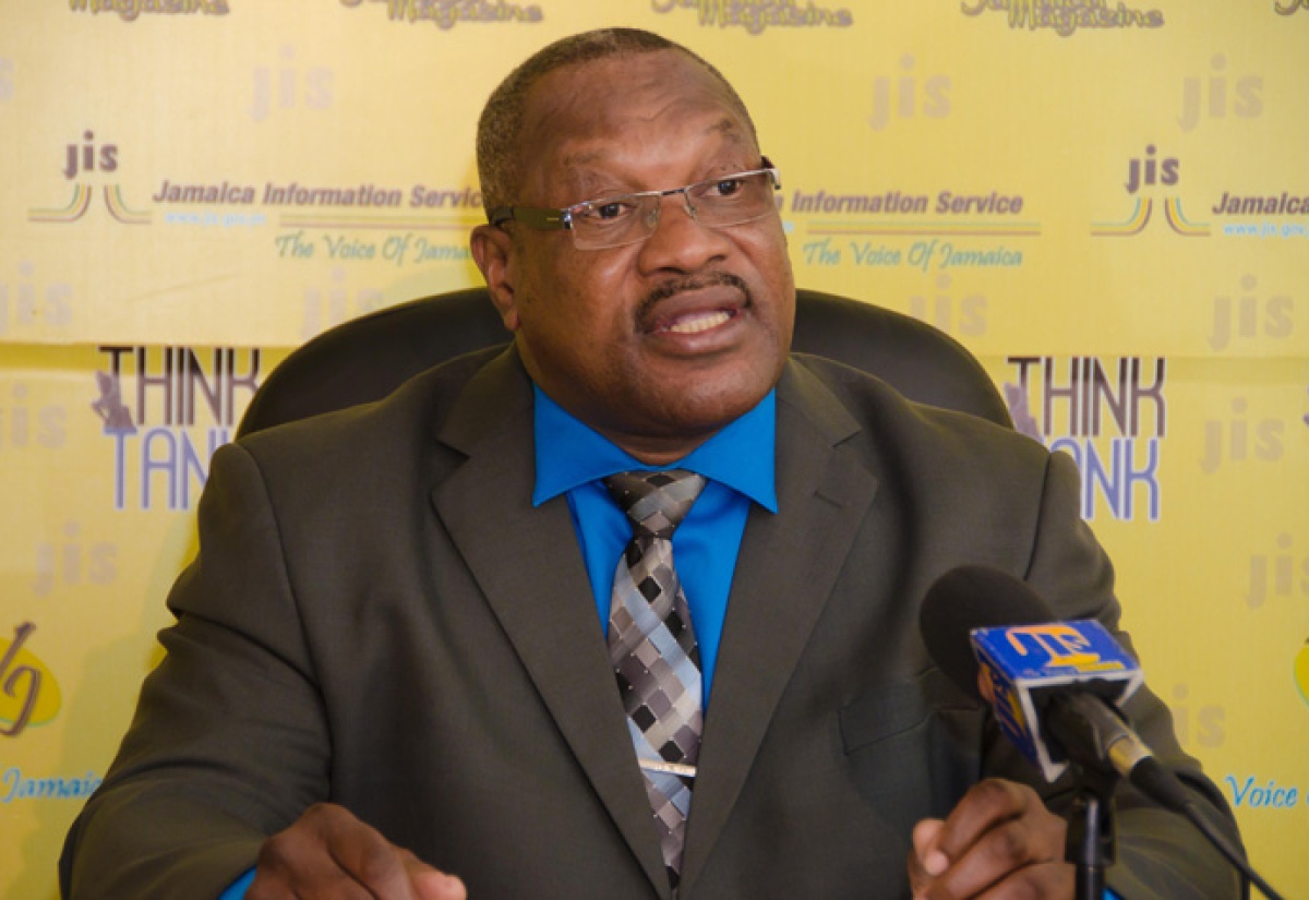 Managing Director of the Transport Authority,  Donald Foster addresses a JIS Think Tank on Wednesday December 9 on new colour coding rules for public passenger vehicles for the 2016 licensing period. 
