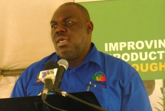 Permanent Secretary in the Ministry of Agriculture and Fisheries,  Mr. Donovan Stanberry, speaking at a Field  Day, held at the Holland Sugar Estate  in St. Elizabeth, on October 16.   