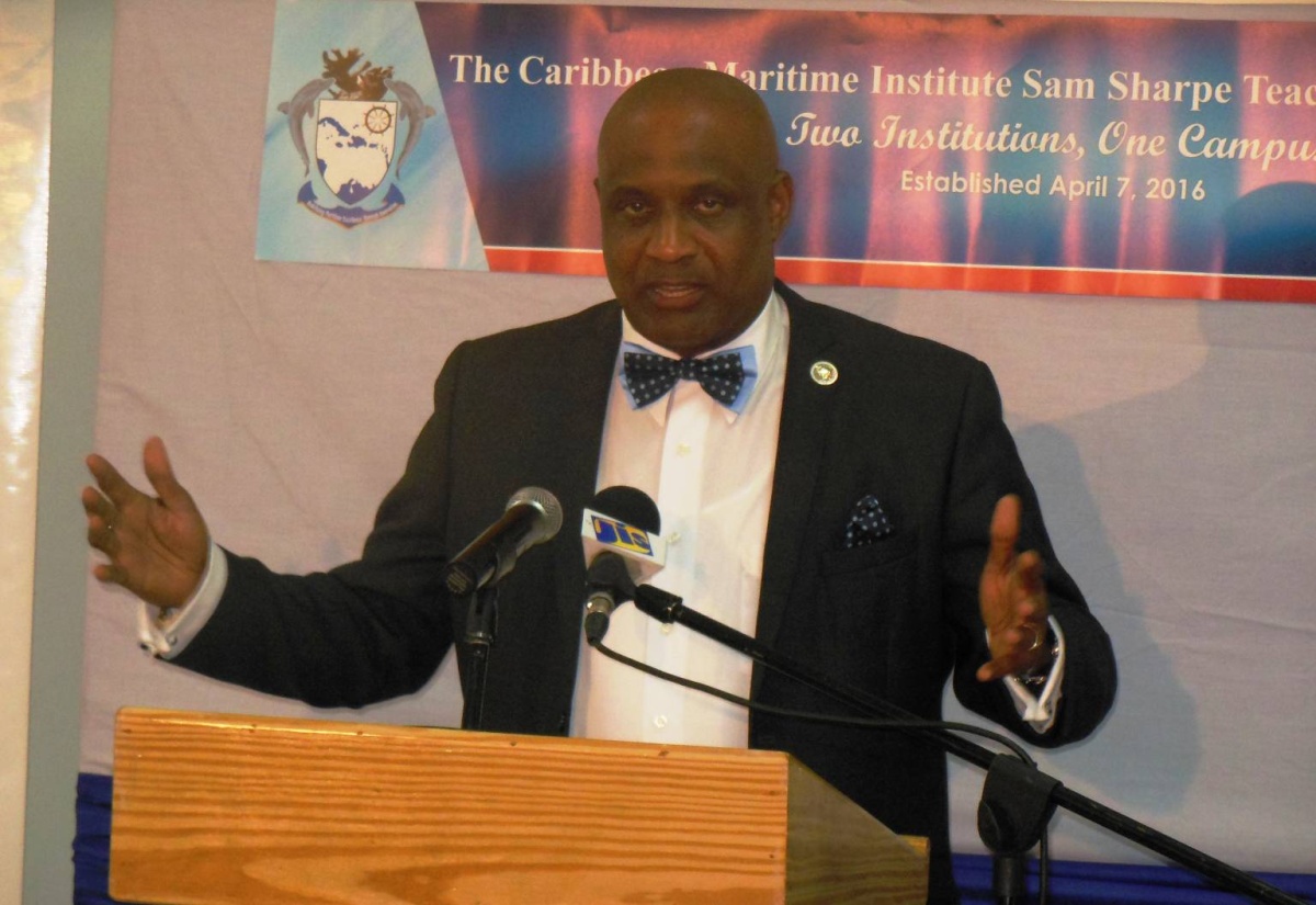 Executive Director of the Caribbean Maritime Institute (CMI), Dr. Fritz Pinnock, addresses the launch of the CMI/Sam Sharpe Teachers’ College Campus in Granville, St. James on April 7.