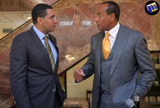 Prime Minster, the Most Hon. Andrew Holness (left), and Chairman of the Economic Growth Council (EGC), Michael Lee-Chin, are in conversation following a press conference at the Office of the Prime Minister on Wednesday (August 17), to provide an update on the work of the EGC.