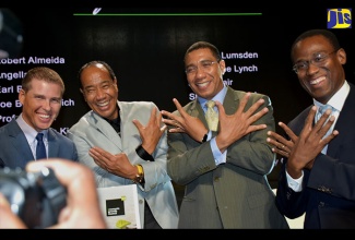Prime Minister, the Most Hon. Andrew Holness (left), and Chairman of the Economic Growth Council (EGC), Michael Lee-Chin, sign a declaration of intent, during a ceremony and call to action at the Courtleigh Auditorium in New Kingston on Monday, November 7. The declaration underscores the Government’s commitment to the specific policies that fall under the eight growth initiatives published by the EGC. 
