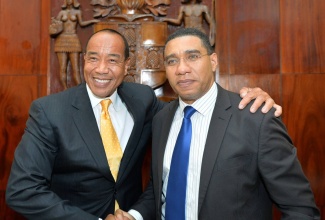 Prime Minister the Most Hon. Andrew Holness (right), greets Chairman, Economic Growth Council, Michael Lee-Chin, at the official launch of the council, yesterday (April 27), at the Office of the Prime Minister, in Kingston.