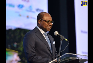 Minister of Tourism, Hon. Edmund Bartlett, addresses the United Nations World Tourism Organization (UNWTO) Global Conference on Tuesday (November 28) at the Montego Bay Convention Centre in St. James.