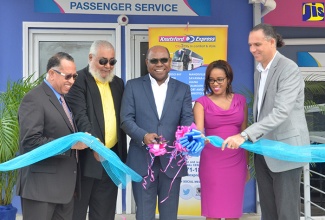 Tourism Minister, Hon. Edmund Bartlett (centre), officially opens the Knutsford Express depot at the Sangster International Airport in Montego Bay on Tuesday (January 9).  Others (from left) are: Executive Director of Knutsford Express, Anthony Copeland; Chairman, Gordon Townsend; President, Montego Bay Chamber of Commerce, T’Shura Gibbs; and Chief Executive Officer, Knutsford Express, Oliver Townsend.