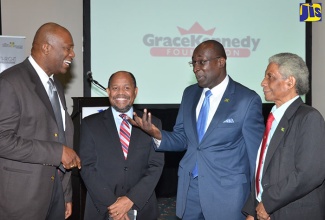 Minister of Education, Youth and Information, Senator the Hon. Ruel Reid (3rd left), is in light discussion with Chairman of the Jamaica Diaspora Education Task Force (JDETF), Leo Gilling (left), at the launch of the Pledge 2 Build Campaign on November 1 at The Jamaica Pegasus hotel, New Kingston. Chairman of the National Education Trust (NET), Nicholas Scott (2nd left), and Executive Director of the Jamaica Diaspora Institute, Neville Ying, shared in the conversation.