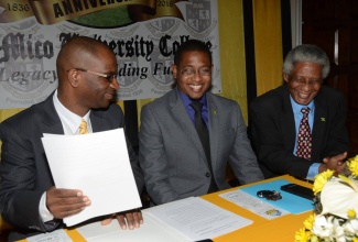 State Minister in the Ministry of Education, Youth and Information, Hon. Floyd Green (centre), having a light exchange with President of Mico University College, Dr. Asburn Pinnock (left), and Pro-Chancellor, Professor Neville Ying (right), at the media launch of the 180th  anniversary celebrations of the university,  held yesterday (March 31), at the institution’s main campus on Marescaux Road, in St. Andrew. 