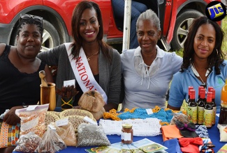 St. James Farm Queen 2016 Sofiya Clennon (3rd right), visits the Jamaica Agricultural Society (JAS) booth at the St. James Business, Health and Opportunities Fair at the Montpelier Agricultural Showground on August 4. Others (from left) are JAS Secretary for St. James, Shanacay Yee; Nethel Scarlett and Clover Record.