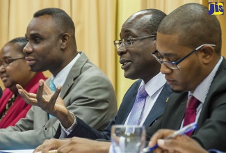 Minister of Education, Youth and Information, Senator the Hon. Ruel Reid (2nd right), addresses a press conference at the offices of the Overseas Examinations Commission in Kingston on February 14 to give an update on developments in the education sector. Others (from left) are: Chief Education Officer, Dr. Grace McLean; Permanent Secretary, Deanroy Bernard; and State Minister in the Ministry, Hon. Floyd Green.