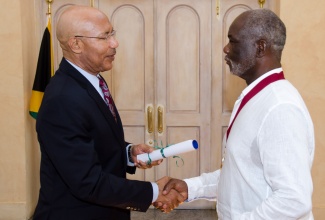 Governor General, His Excellency the Most Hon. Sir Patrick Allen (left), presents the National Choral of Jamaica Medal of Excellence to renowned Jamaican opera singer, Sir Willard White, during a ceremony held on August 11 at King’s House. The Medal of Excellence is conferred upon a musician or other performing artist or individual engaged in the area of music, in recognition of outstanding achievements and significant contribution to the arts in Jamaica and internationally.