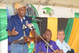 Minister without Portfolio in the Ministry of Industry, Commerce, Agriculture and Fisheries, Hon. J.C. Hutchinson, addresses the relaunch of the National School Garden Programme on October 28 at the Mocho Primary School in Clarendon. Others seated (from right) are Managing Director at Newport Fersan, Dennis Valdez; and Acting Chief Executive Officer of the Rural Agricultural Development Authority (RADA), Peter Thompson.