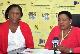 Minister of Culture, Gender, Entertainment and Sport, Hon. Olivia Grange (right), speaks on gender issues at a Jamaica Information Service (JIS) Think Tank held recently at the agency’s head office in Kingston. At left is Director, Policy and Research of the Bureau of Gender Affairs, Sharon Robinson.