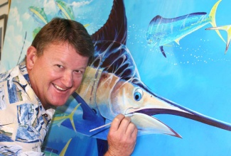 Jamaican born marine wildlife artist, oceanographer and film maker, Dr. Guy Harvey.