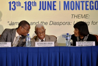 Prime Minister, the Most Hon. Portia Simpson Miller (right), in discussion with Minister of Foreign Affairs and Foreign Trade,  Senator the Hon. A. J. Nicholson (centre) and State Minister in the Ministry, Hon. Arnaldo Brown, at the opening ceremony for the 6th Biennial Jamaica Diaspora Conference, at the Hilton Rose Hall Resort in Montego Bay, on  June 14. Mrs. Simpson Miller delivered the keynote address for the conference, which is being staged at the Montego Bay Convention Centre from June 15 to 18 under the theme: ‘Jamaica and the Diaspora: Linking for Growth and Prosperity’.