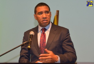 Prime Minister, the Most Hon. Andrew Holness, addresses the 19th staging of the Forum on Markets Innovation and Capital (FOROMIC), at the Montego Bay Convention Centre, Rose Hall, St. James, on October 24. 
